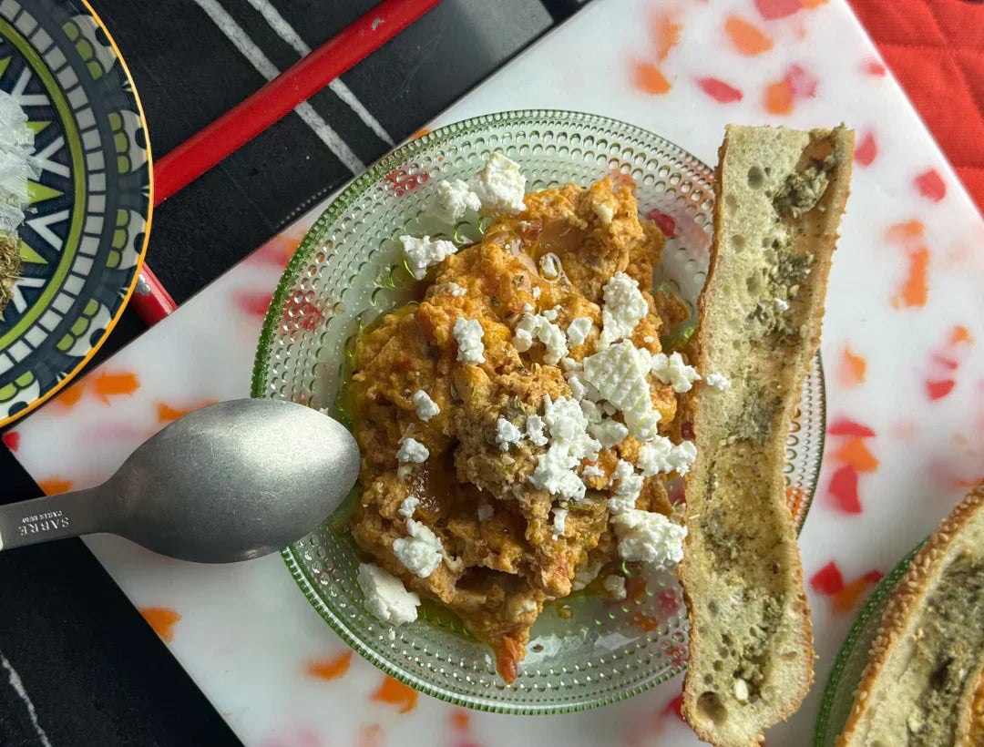 Greek strapatsada tomato and feta egg scramble finished with early harvest olive oil and oregano