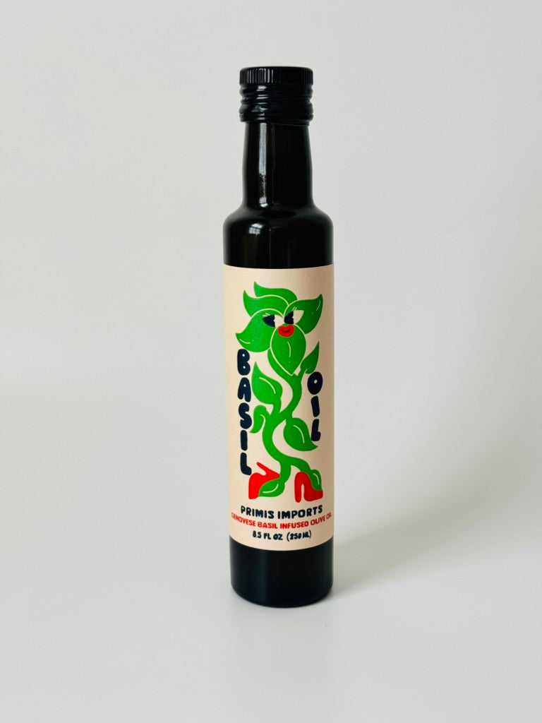 Bottle of basil oil with a label on a white background